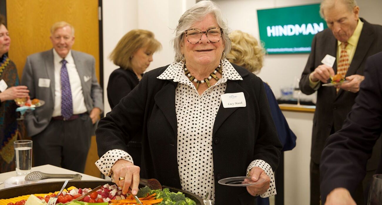 Woman smiling grabbing food