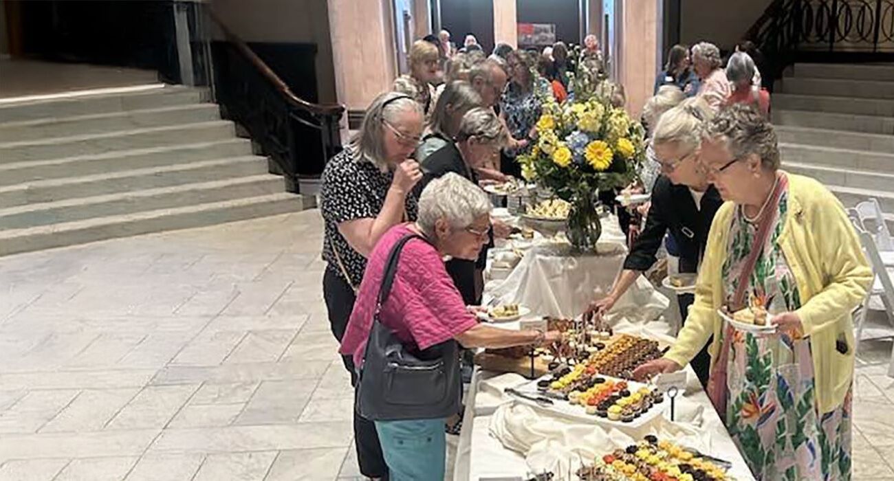 People getting food from buffet